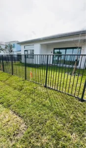 Aluminum fence installation in Fort Lauderdale FL by a fence company near me, featuring a black metal fence for security, durability, and modern curb appeal in Broward County.