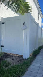 White vinyl PVC fence installation in Fort Lauderdale FL by a fence company near me, creating a private backyard enclosure in Broward County.